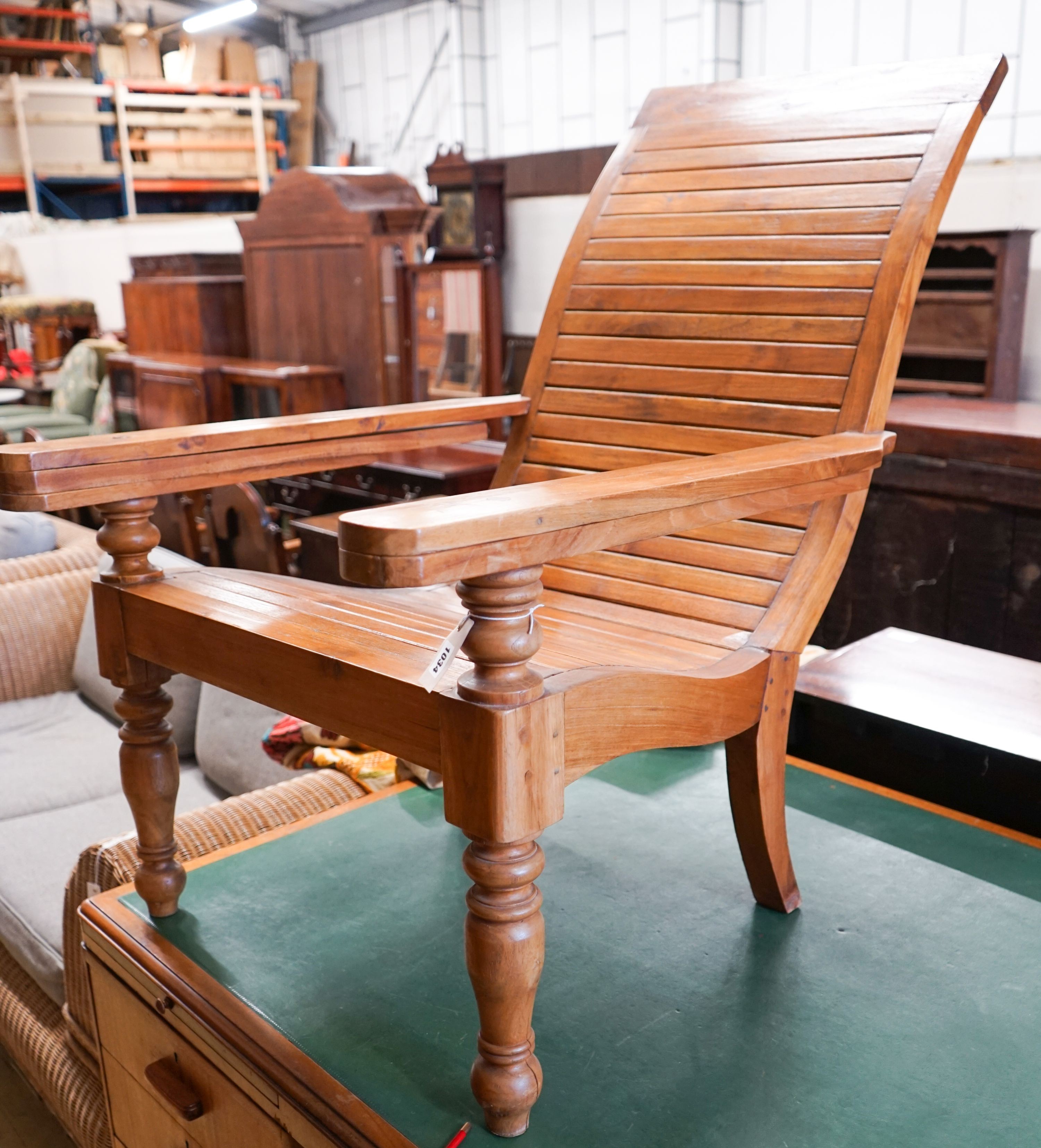 A hardwood plantation chair, width 73cm, depth 110cm, height 104cm